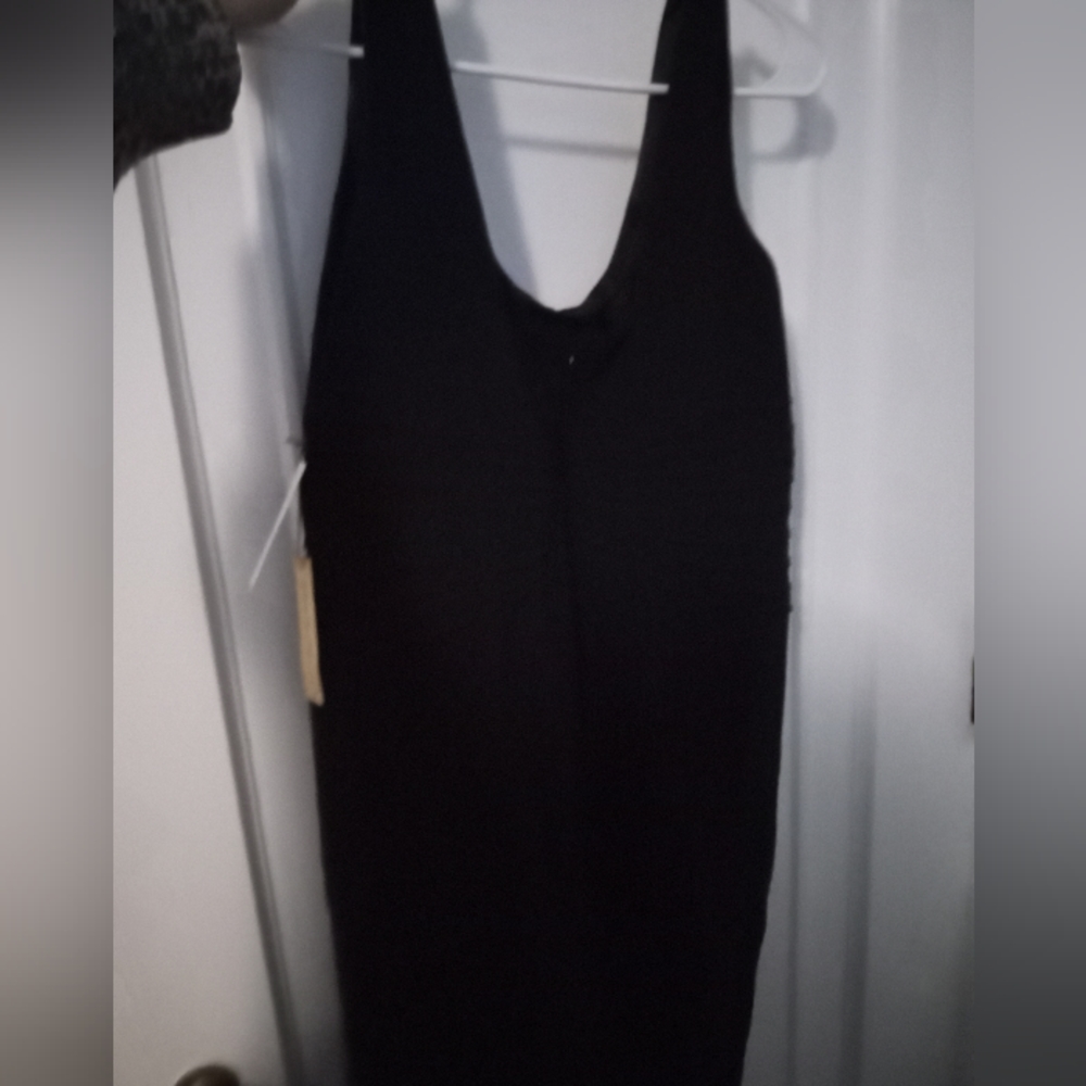 Semi formal black dress with tags.